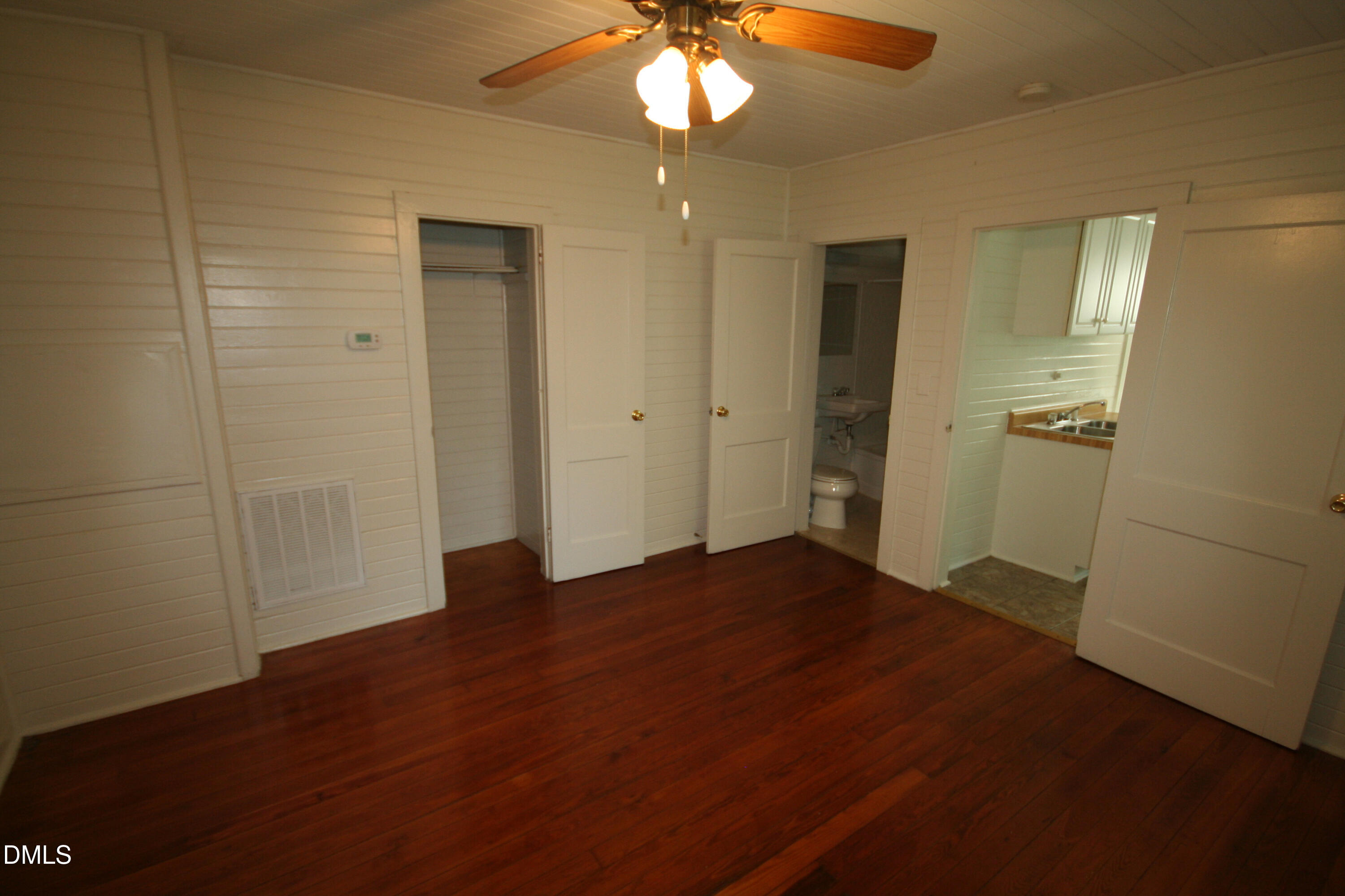 1020 Sedgefield Street Durham, NC 27705 - Photo 12 of 21 a view of empty room with wooden floor