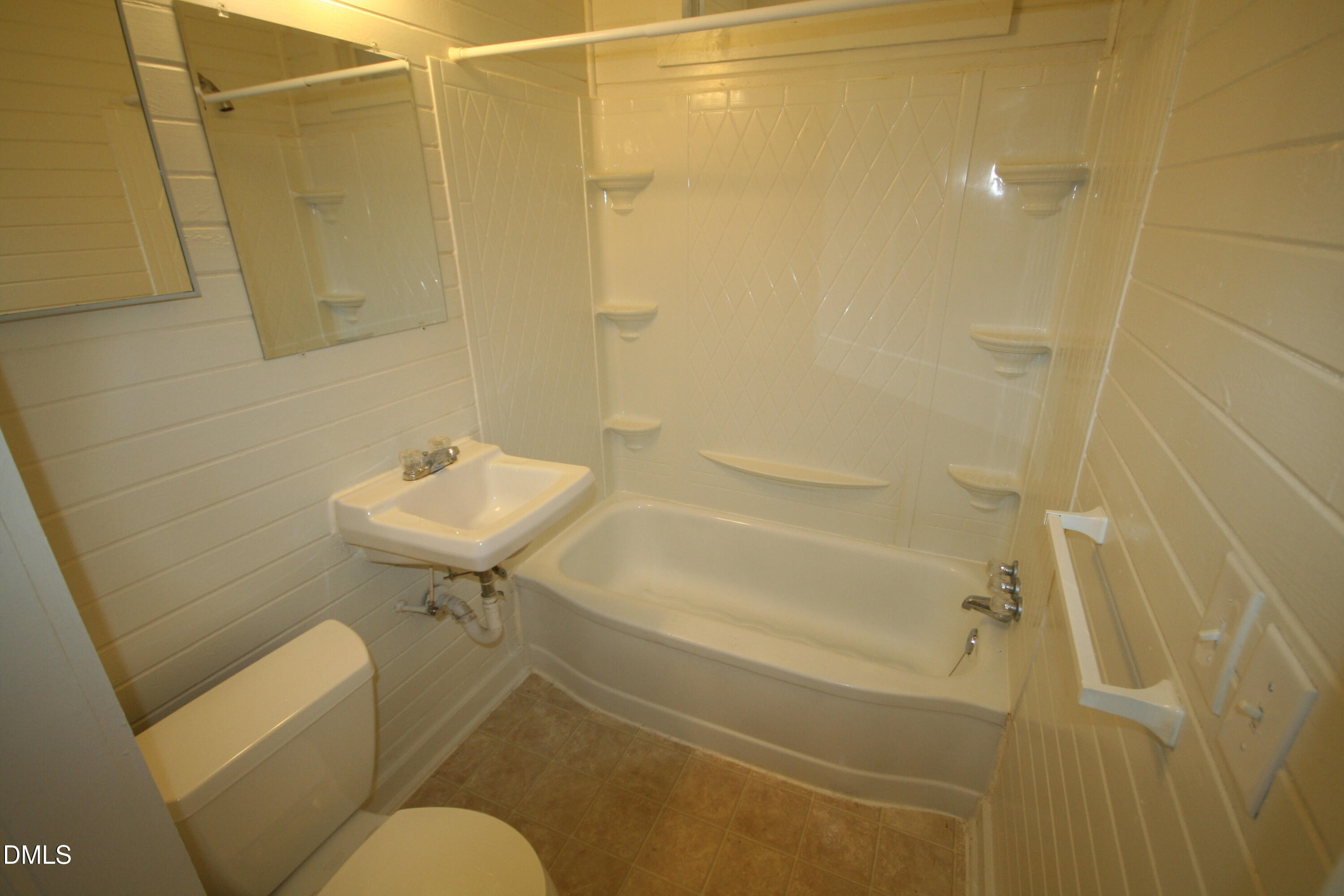 1020 Sedgefield Street Durham, NC 27705 - Photo 13 of 21 a bathroom with a sink toilet and shower