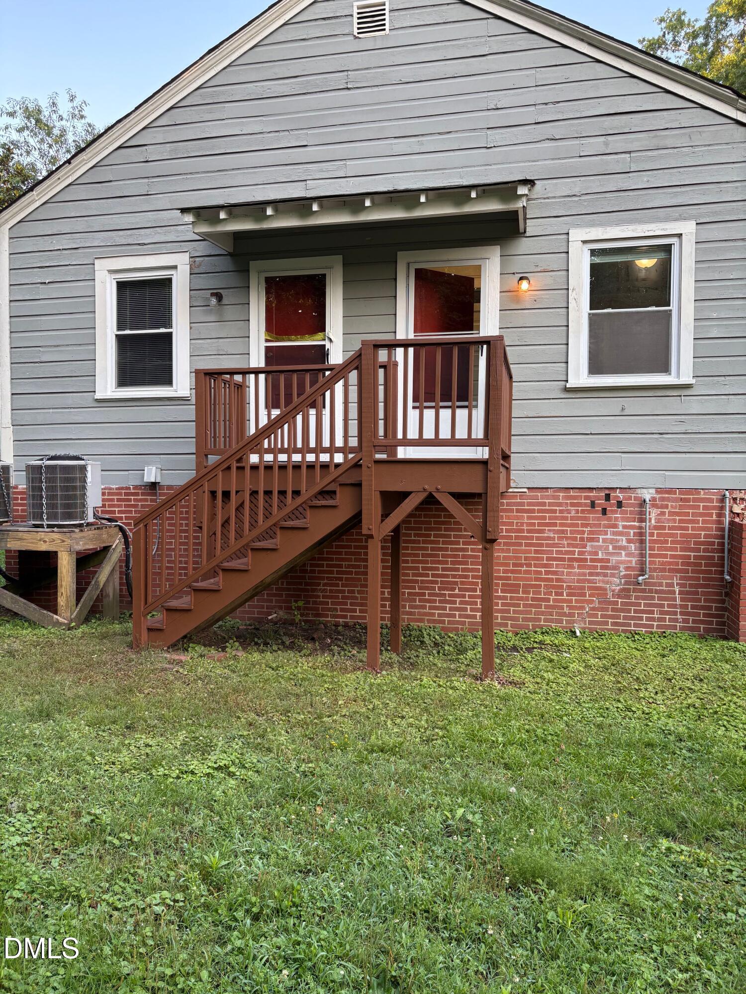 1020 Sedgefield Street Durham, NC 27705 - Photo 17 of 21 a view of a house with a yard and deck