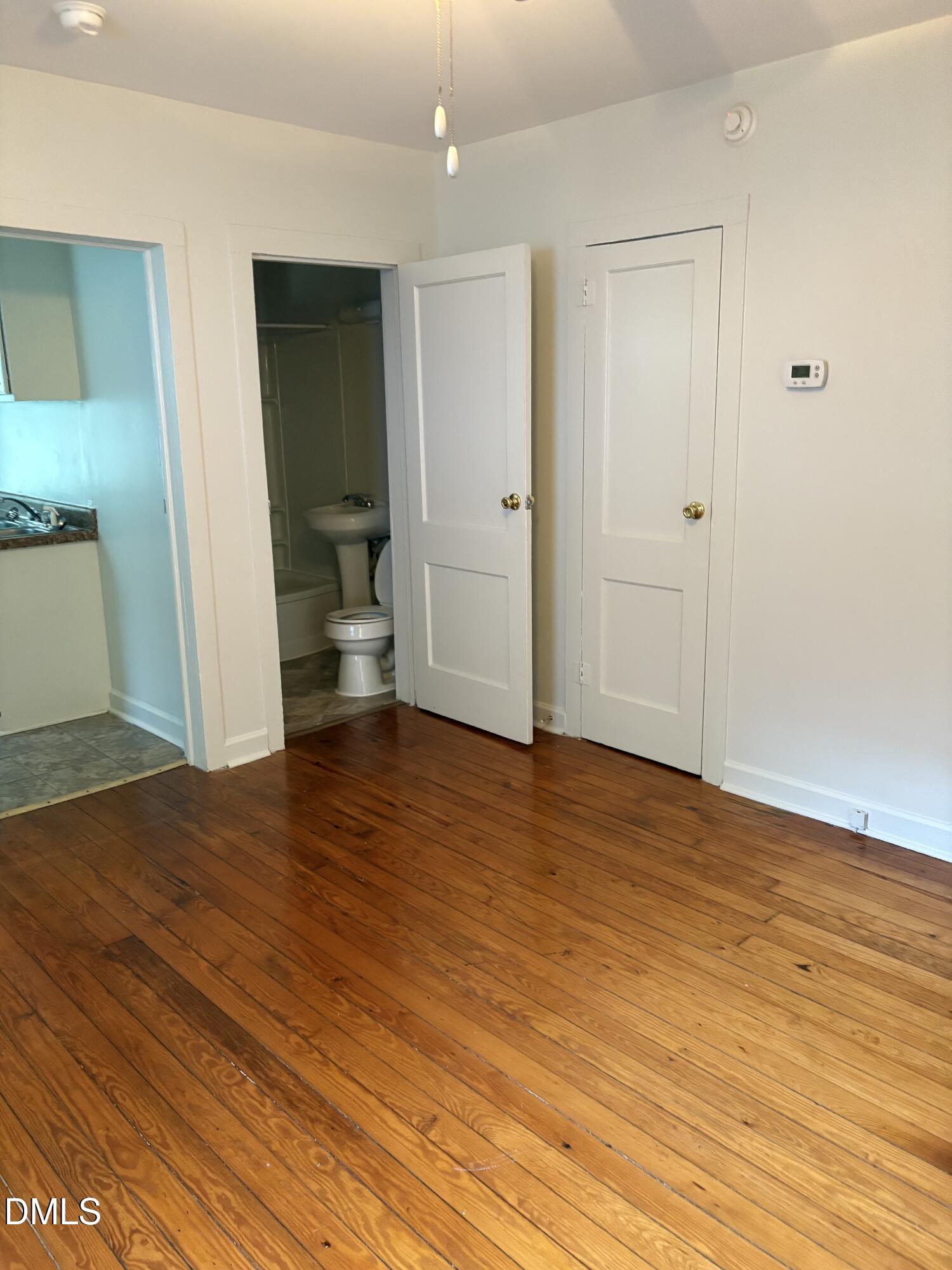 1020 Sedgefield Street Durham, NC 27705 - Photo 5 of 21 a view of an empty room and wooden floor