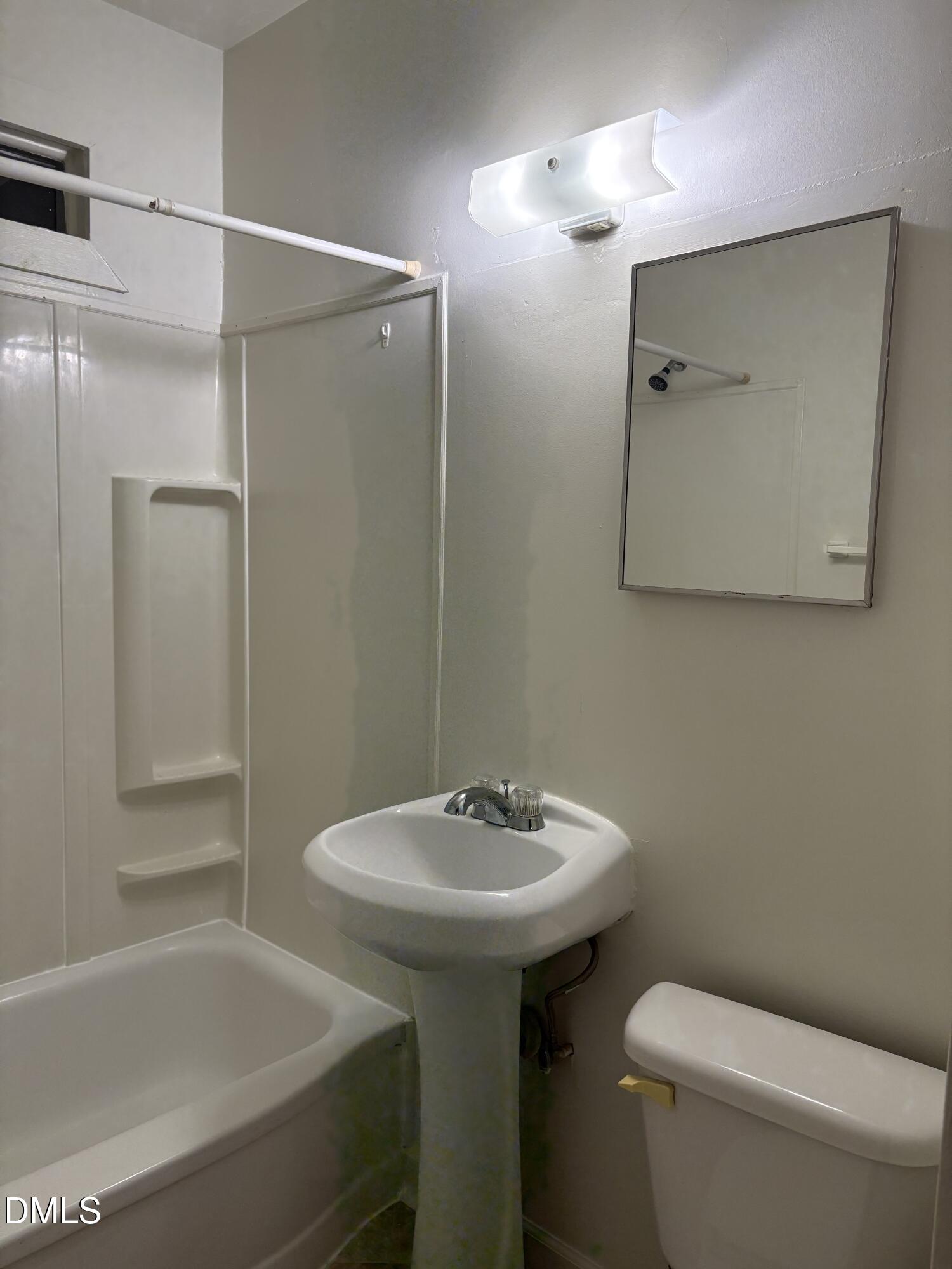 1020 Sedgefield Street Durham, NC 27705 - Photo 6 of 21 a bathroom with a sink toilet and shower