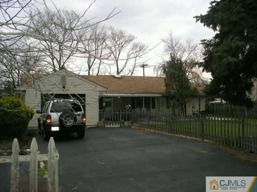 354 Old Post Road Edison, NJ 08817 - Photo 7 of 8 a front view of a house with cars parked
