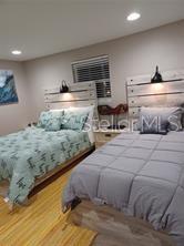 6728 Sea Ranch Drive Hudson, FL 34667 - Photo 23 of 69 a bedroom with a bed and a window