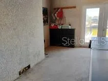 a view of a yard with iron fence