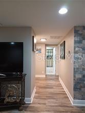 6728 Sea Ranch Drive Hudson, FL 34667 - Photo 7 of 69 a view of a livingroom with wooden floor and a flat screen tv