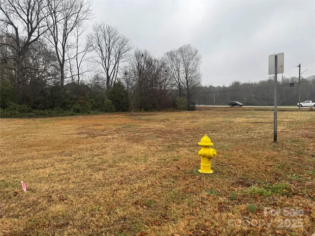 a swimming pool with an outdoor space and seating area