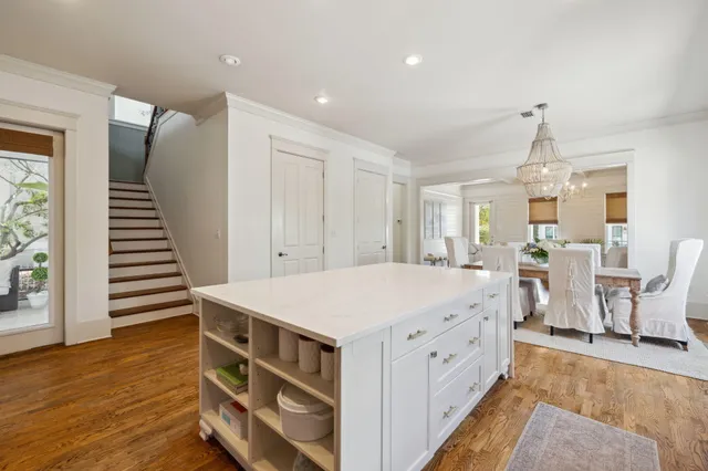 a spacious bathroom with a granite countertop sink and a mirror