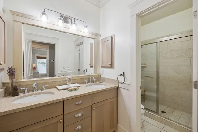 a bathroom with a double vanity sink and a mirror