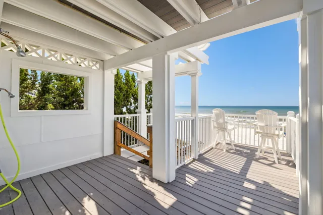 a swimming pool with outdoor seating and yard