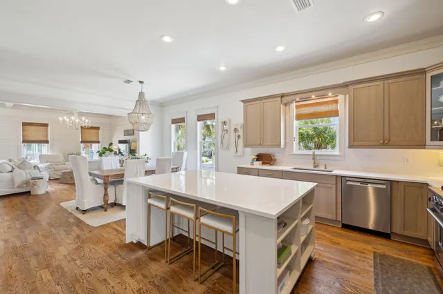 a large kitchen with a table and chairs