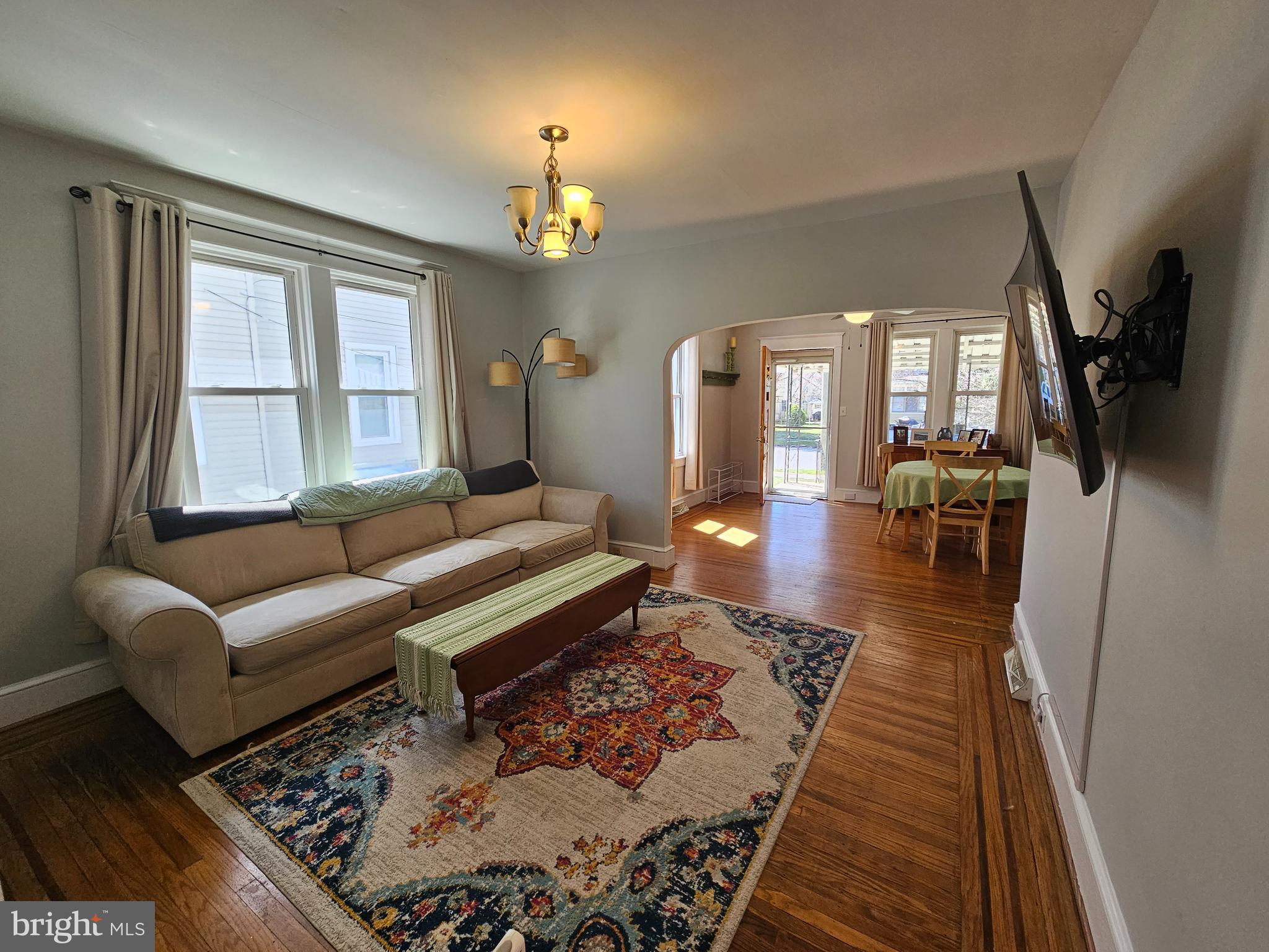 303 Delaware Avenue Riverside, NJ 08075 - Photo 11 of 30 a living room with furniture and a chandelier