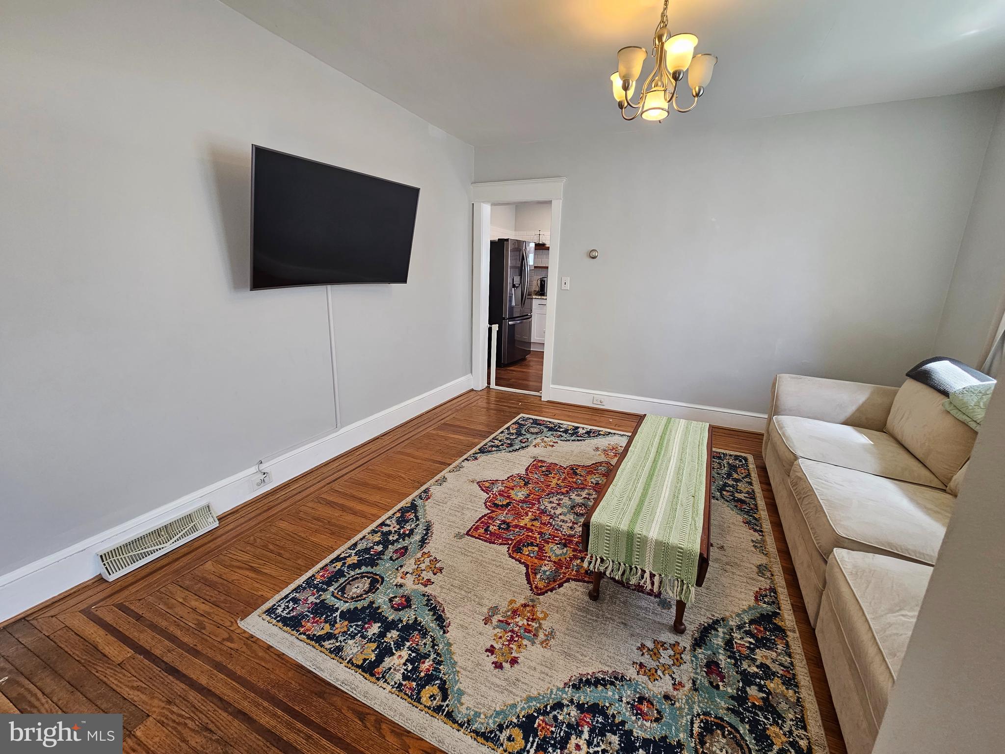 303 Delaware Avenue Riverside, NJ 08075 - Photo 13 of 30 a bedroom with a bed and a flat screen tv