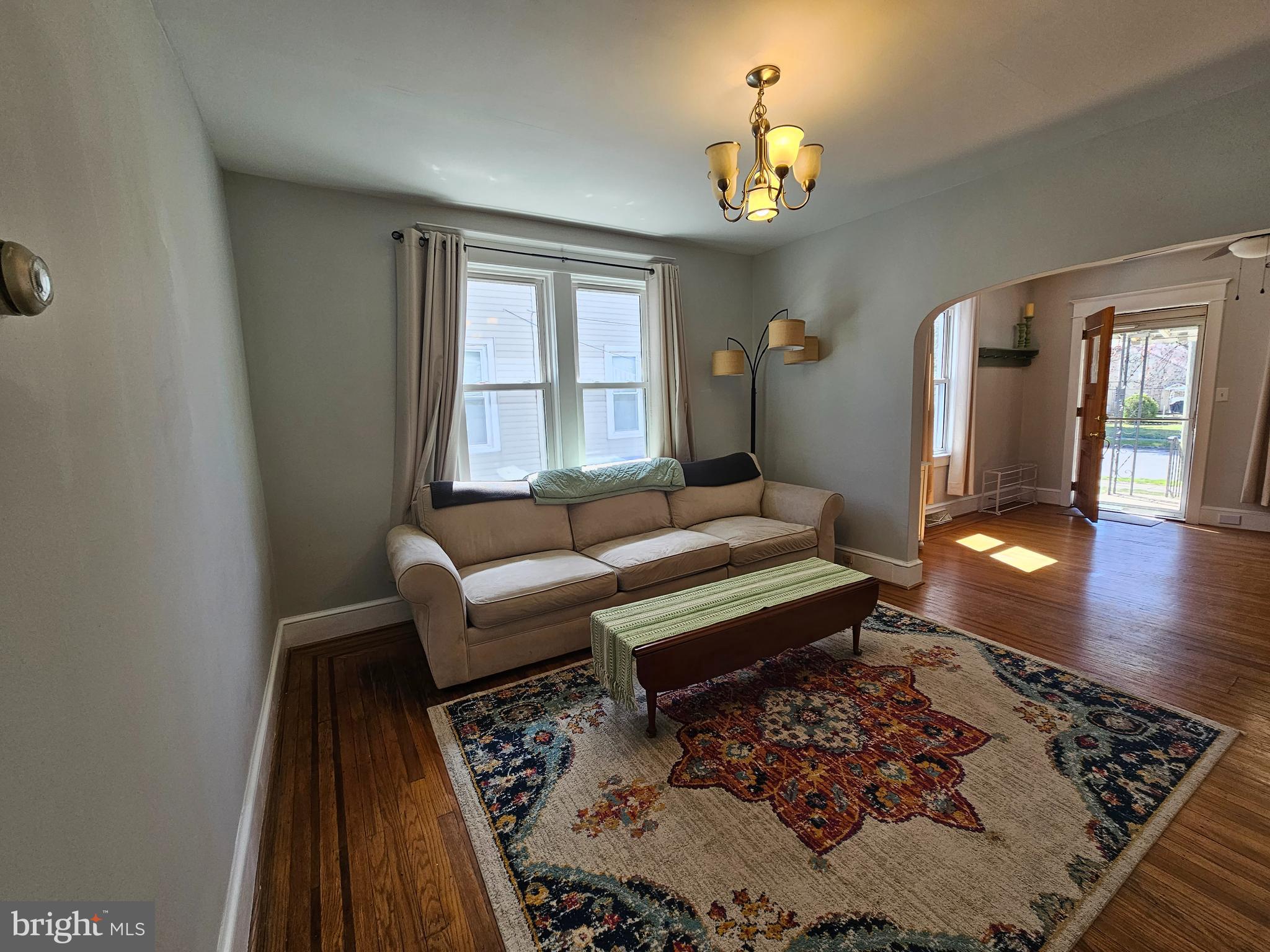 303 Delaware Avenue Riverside, NJ 08075 - Photo 14 of 30 a living room with furniture and a chandelier