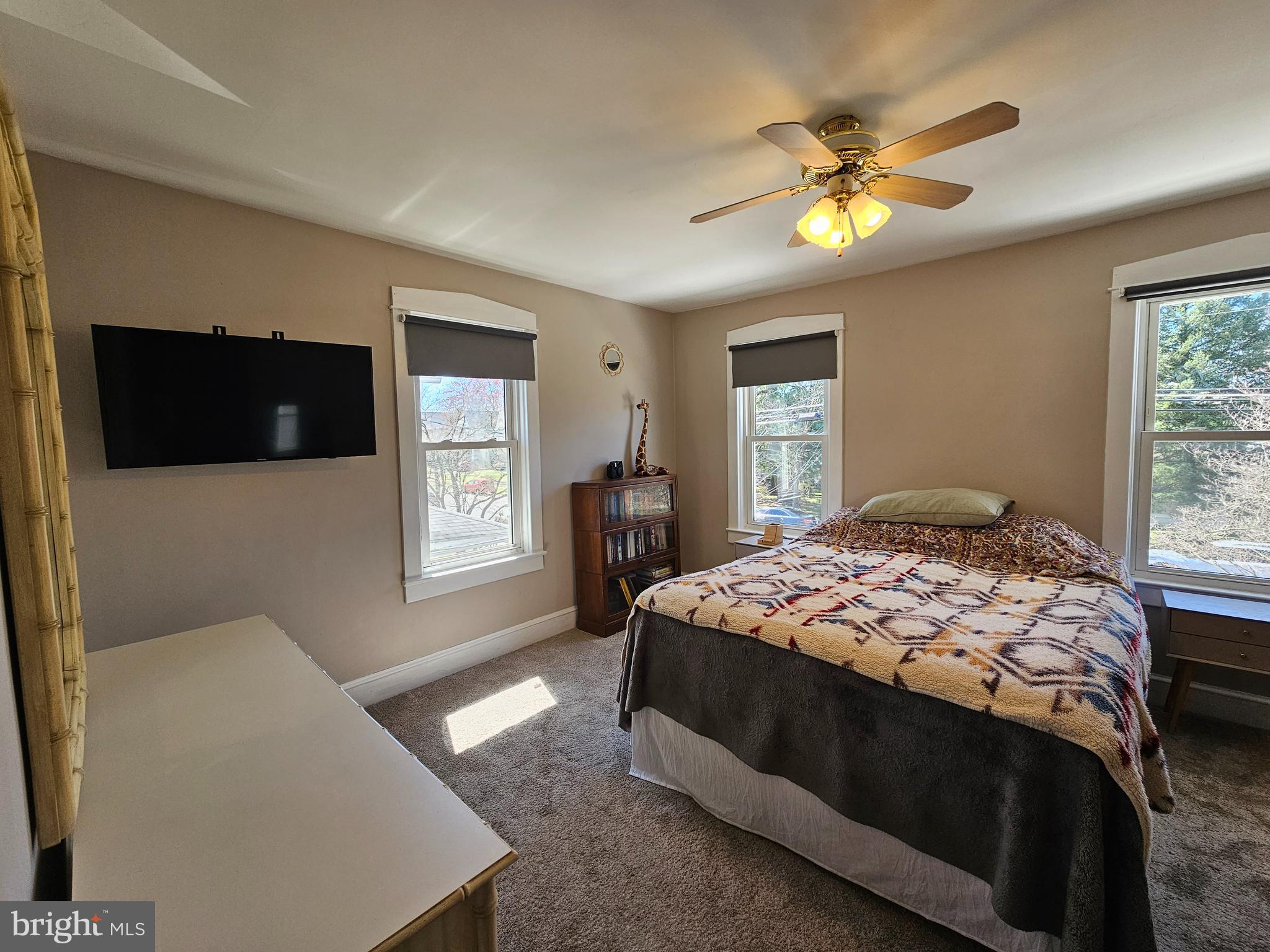 303 Delaware Avenue Riverside, NJ 08075 - Photo 18 of 30 a bedroom with a bed and a chandelier