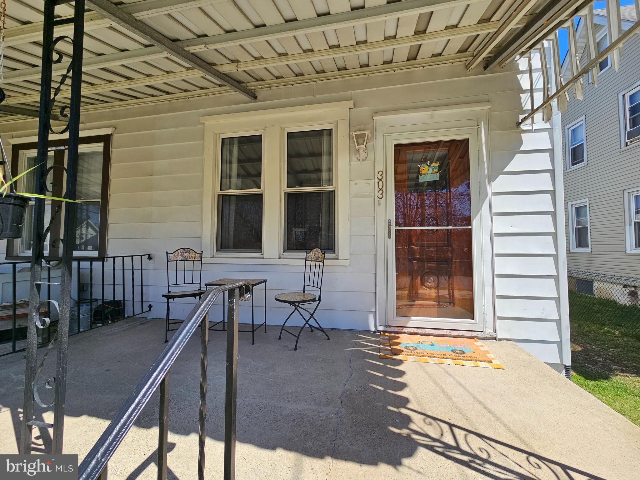 303 Delaware Avenue Riverside, NJ 08075 - Photo 2 of 30 a balcony view with a couple of couches and potted plants