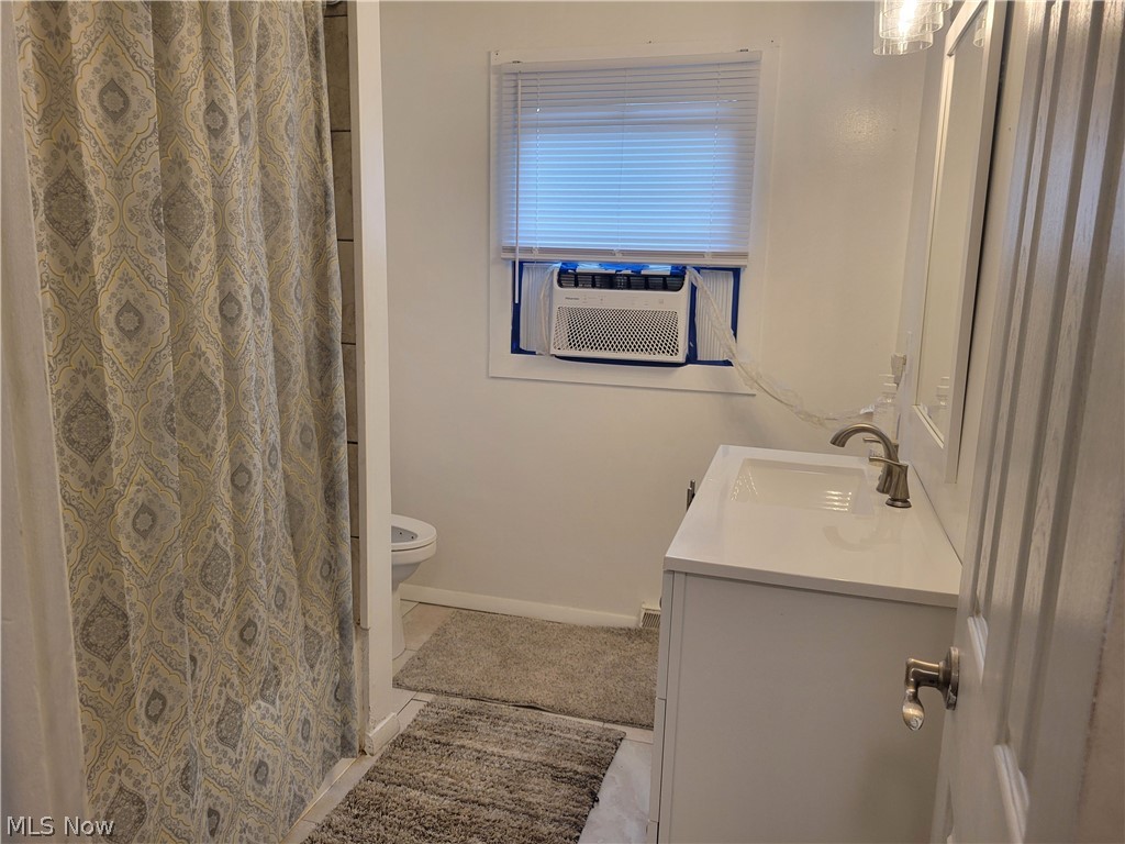 4895 Lear Nagle Road North Ridgeville, OH 44039 - Photo 17 of 27 Bathroom featuring tile flooring, toilet, and vanity