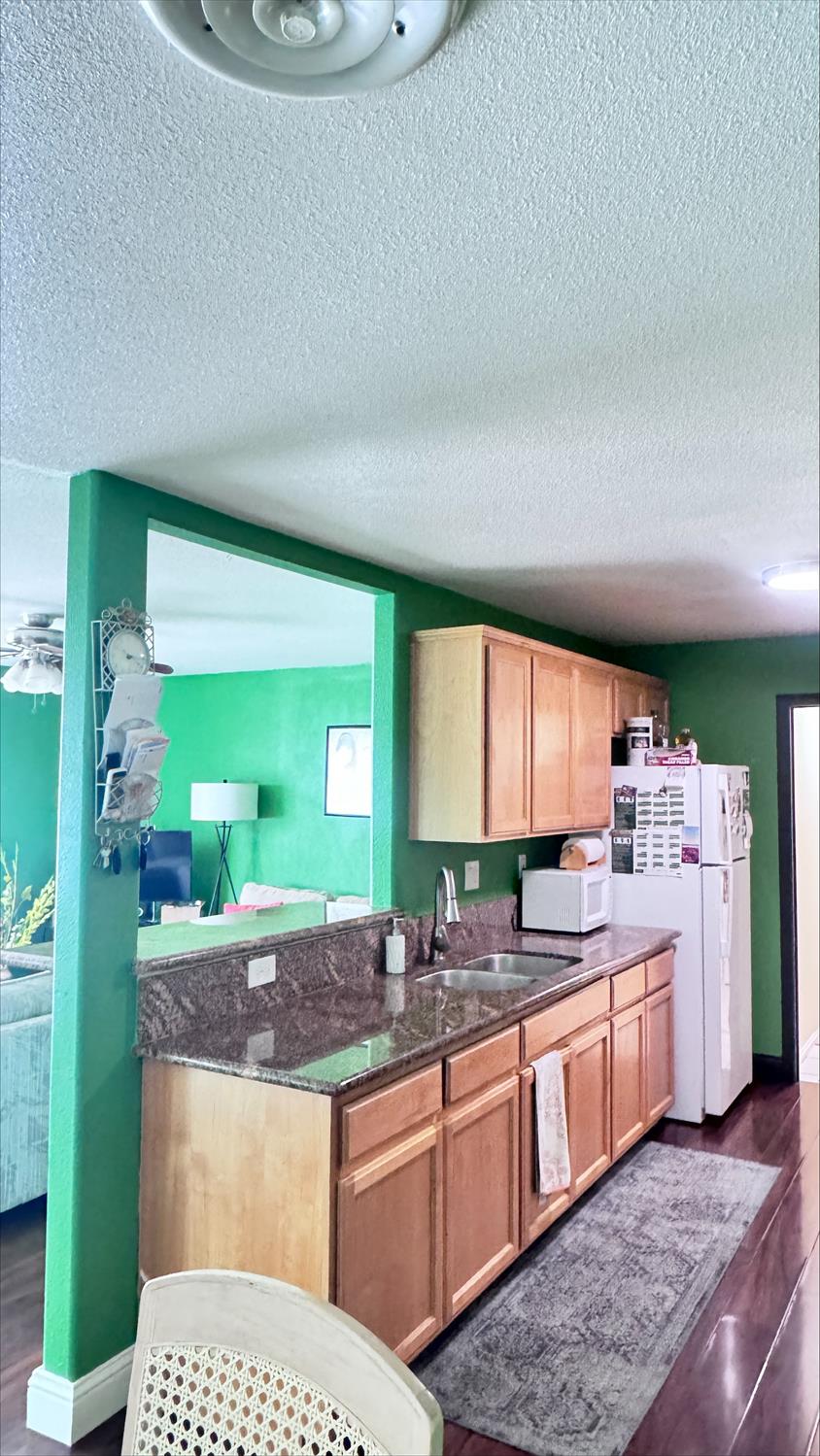410 Sage Street Gridley, CA 95948 - Photo 11 of 43 a spacious bathroom with a granite countertop sink and a mirror
