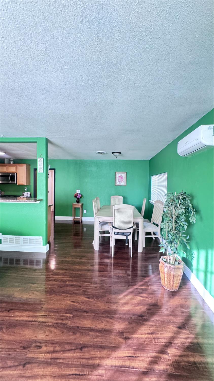 410 Sage Street Gridley, CA 95948 - Photo 3 of 43 a view of a dining room with furniture and wooden floor