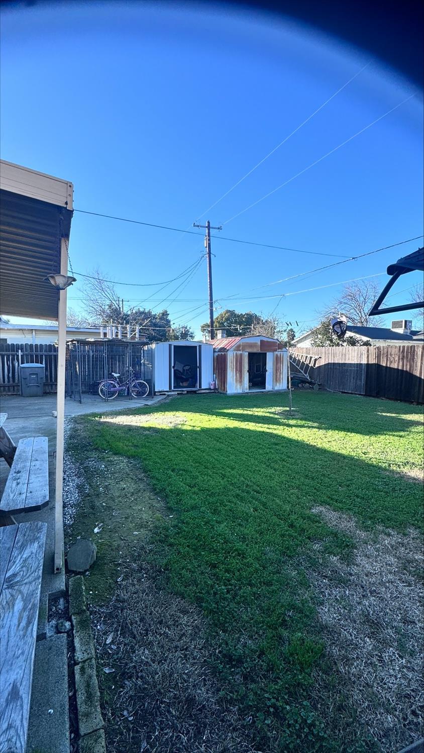 410 Sage Street Gridley, CA 95948 - Photo 37 of 43 a view of a garden with a house in the background