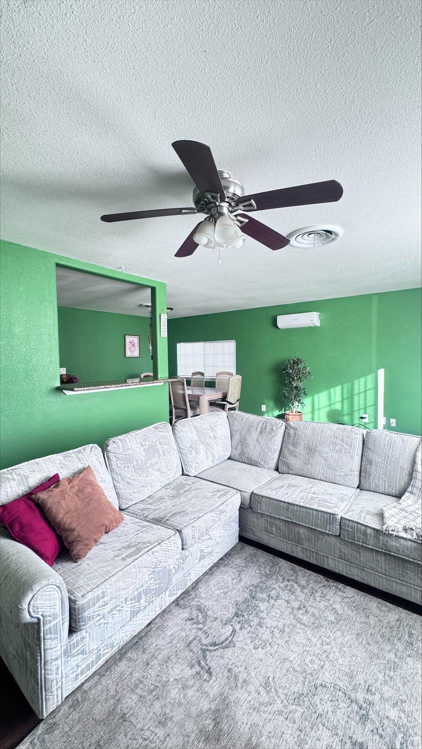 410 Sage Street Gridley, CA 95948 - Photo 9 of 43 a living room with furniture and a large window