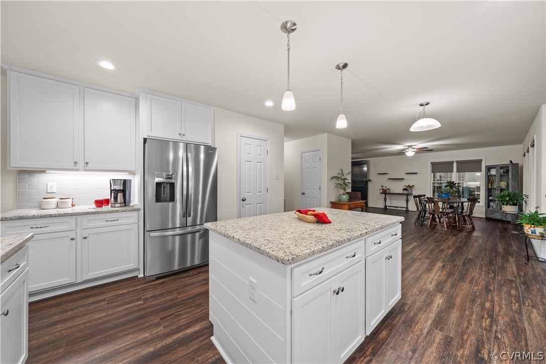 2829 Preston Park Way Sandy Hook, VA 23153 - Photo 14 of 36 a kitchen with a refrigerator a sink and wooden floor