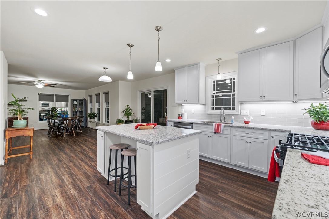 2829 Preston Park Way Sandy Hook, VA 23153 - Photo 15 of 36 a kitchen that has a lot of cabinets a sink and a stove in it