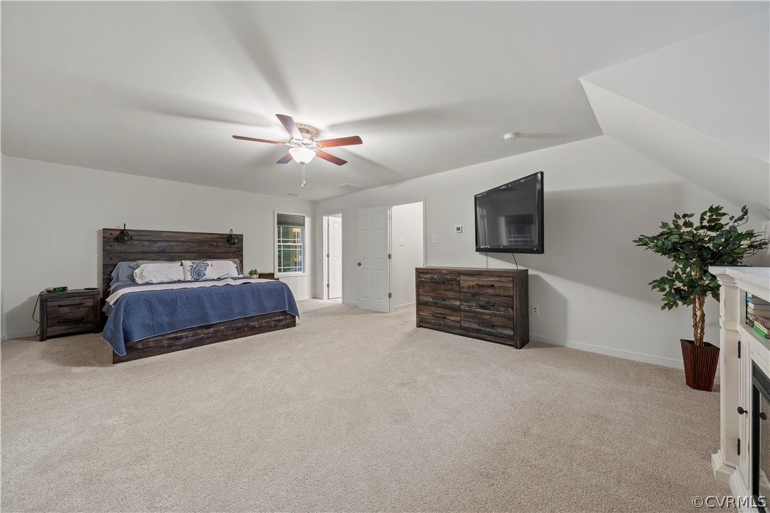 2829 Preston Park Way Sandy Hook, VA 23153 - Photo 17 of 36 a living room with furniture a chandelier and a flat screen tv