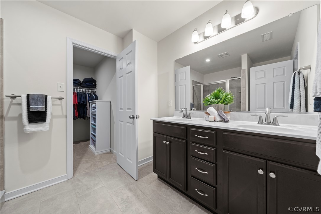 2829 Preston Park Way Sandy Hook, VA 23153 - Photo 20 of 36 a bathroom with a double vanity sink and a mirror