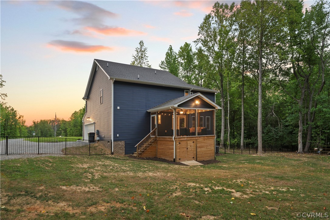 2829 Preston Park Way Sandy Hook, VA 23153 - Photo 3 of 36 a front view of a house with a garden