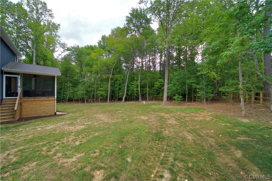 2829 Preston Park Way Sandy Hook, VA 23153 - Photo 35 of 36 a view of a backyard with large trees
