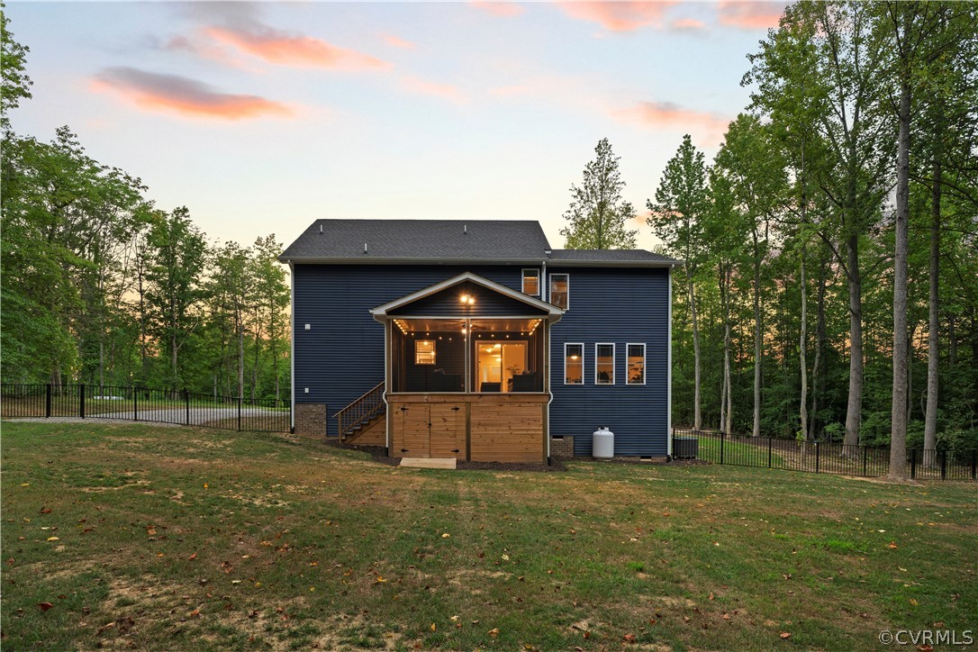 2829 Preston Park Way Sandy Hook, VA 23153 - Photo 4 of 36 a front view of a house with a garden
