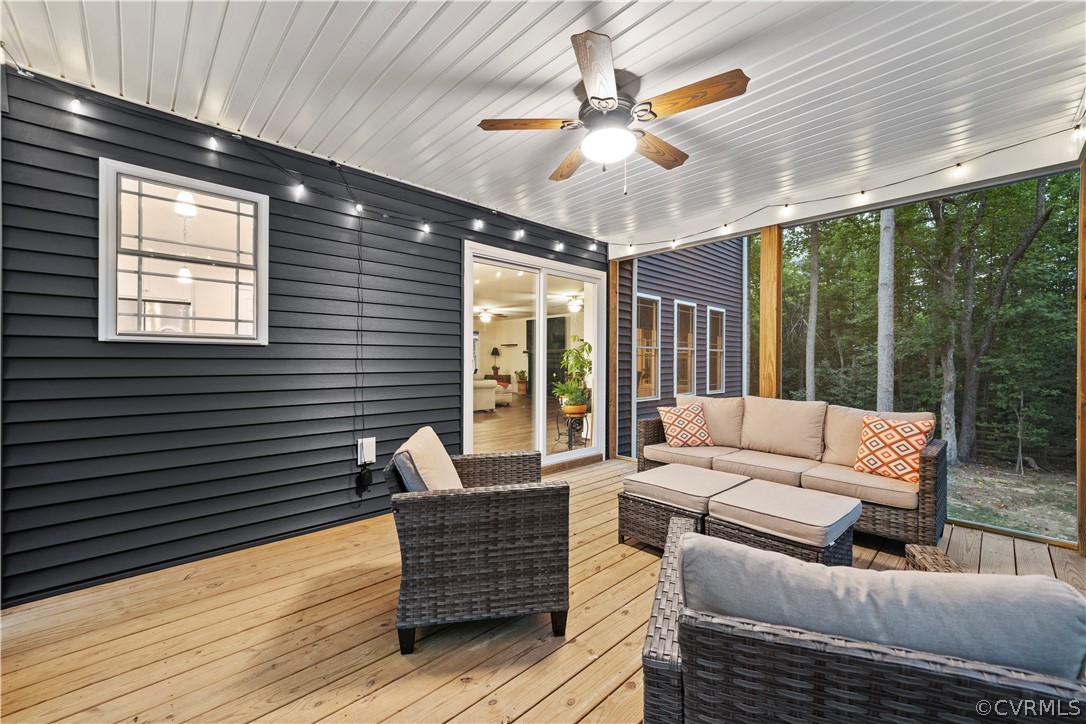 2829 Preston Park Way Sandy Hook, VA 23153 - Photo 7 of 36 a living room with furniture and a large window
