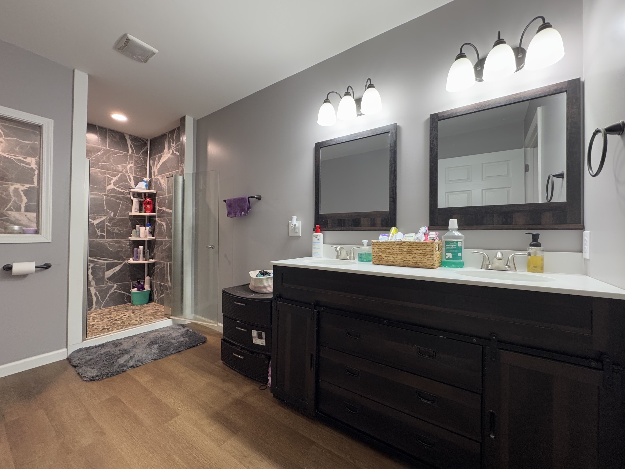 2938 Salmon Branch Road Erin, TN 37061 - Photo 4 of 12 a bathroom with a double vanity sink and a mirror