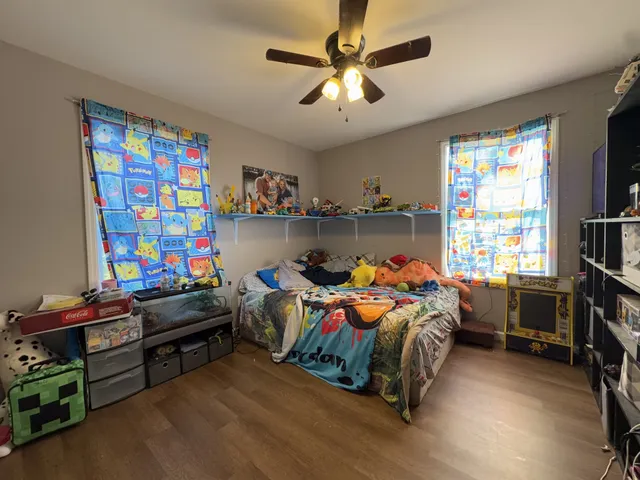 a bed room with furniture and a window