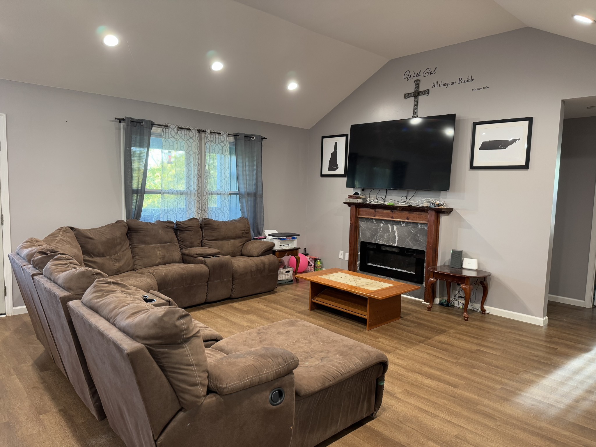 2938 Salmon Branch Road Erin, TN 37061 - Photo 10 of 12 a living room with furniture a flat screen tv and a fireplace