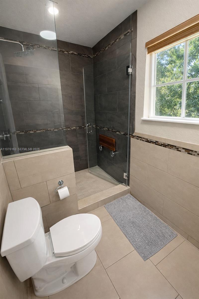 3500 Southwest 128th Avenue Miami, FL 33175 - Photo 16 of 27 a bathroom with a toilet a sink and shower