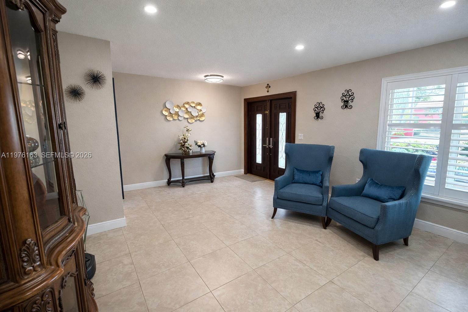 3500 Southwest 128th Avenue Miami, FL 33175 - Photo 17 of 27 a living room with furniture and a window
