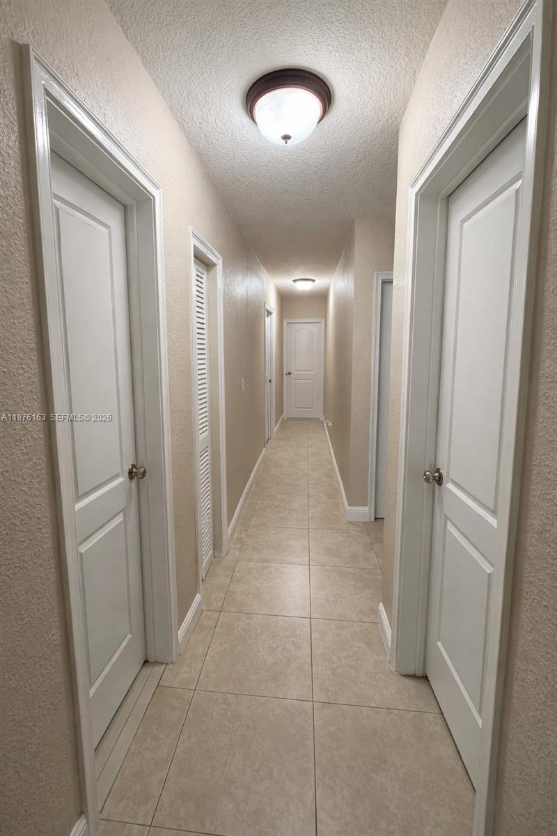 3500 Southwest 128th Avenue Miami, FL 33175 - Photo 27 of 27 a view of a hallway with wooden floor