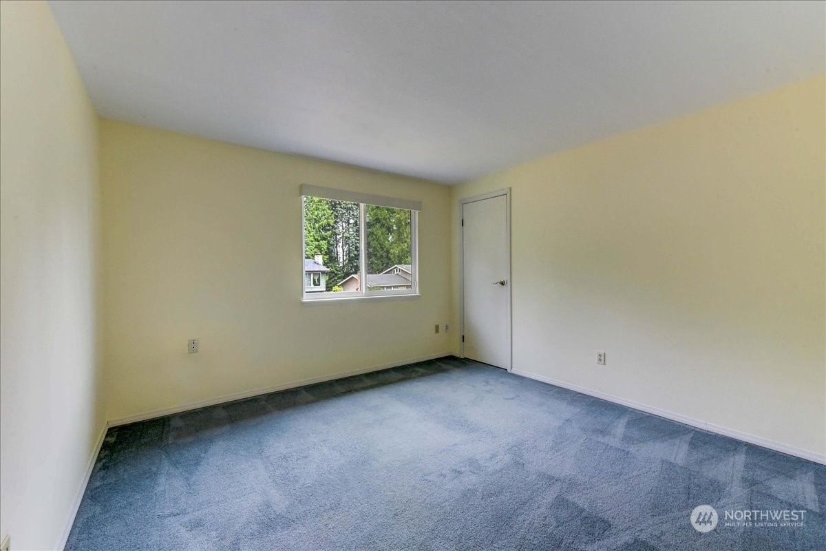 10451 Northeast 204th Place Bothell, WA 98011 - Photo 31 of 40 an empty room with a window