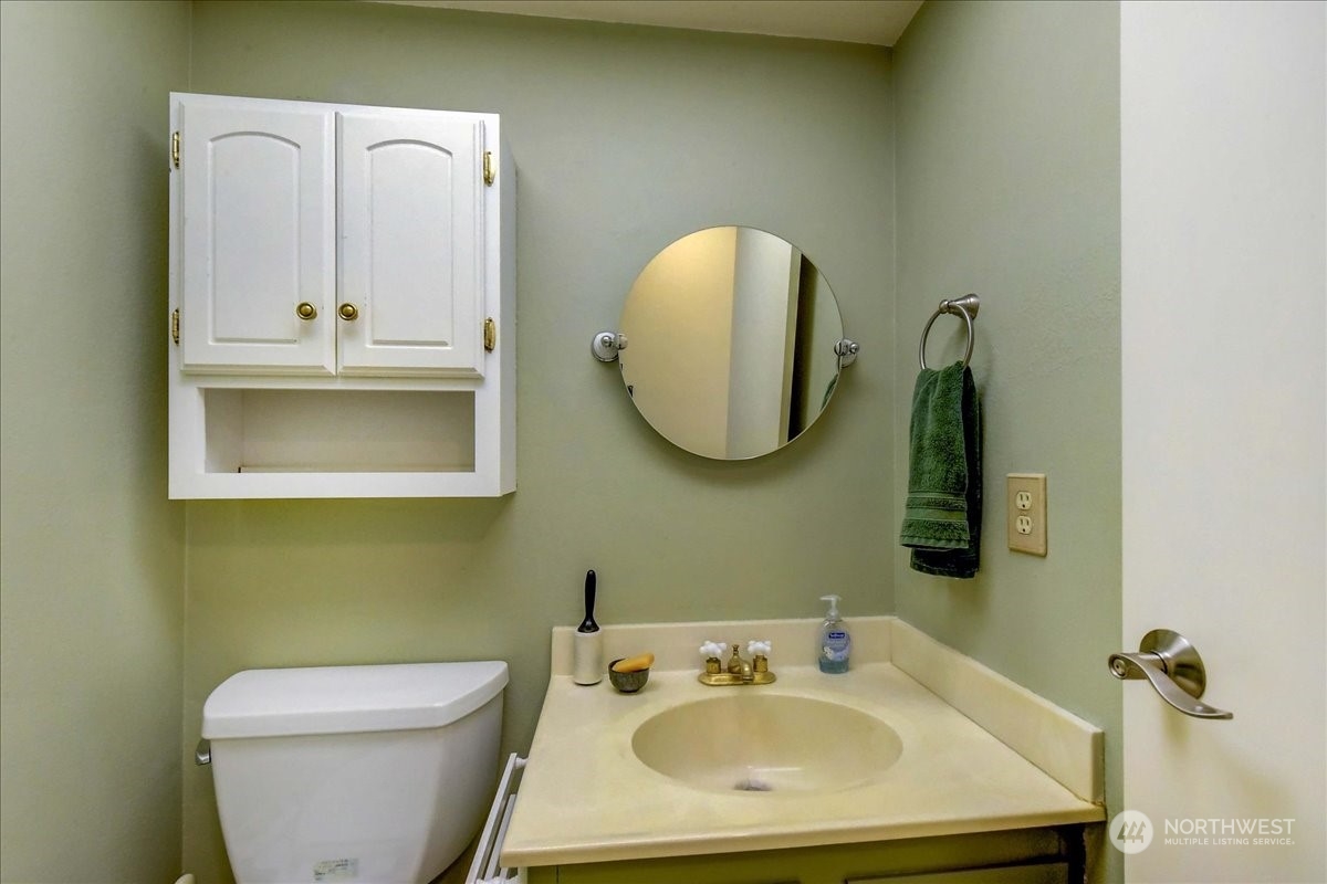 10451 Northeast 204th Place Bothell, WA 98011 - Photo 35 of 40 a bathroom with a sink and a mirror