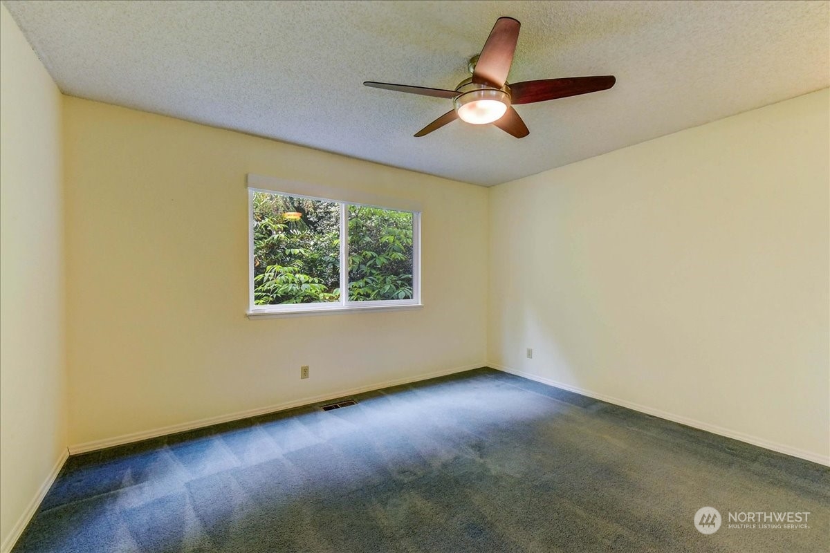 10451 Northeast 204th Place Bothell, WA 98011 - Photo 10 of 40 an empty room with a window
