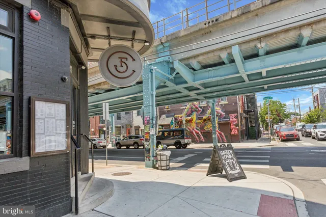 a view of a brick building with a door and a window