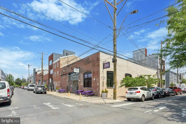 a view of a cars parked on the side of a street