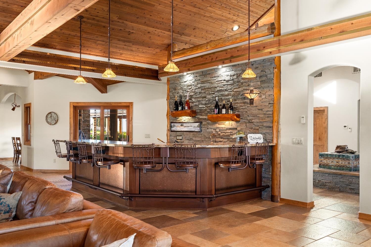 5630 Grazing Hill Road Shingle Springs, CA 95682 - Photo 28 of 86 a living room with lots of furniture and a chandelier