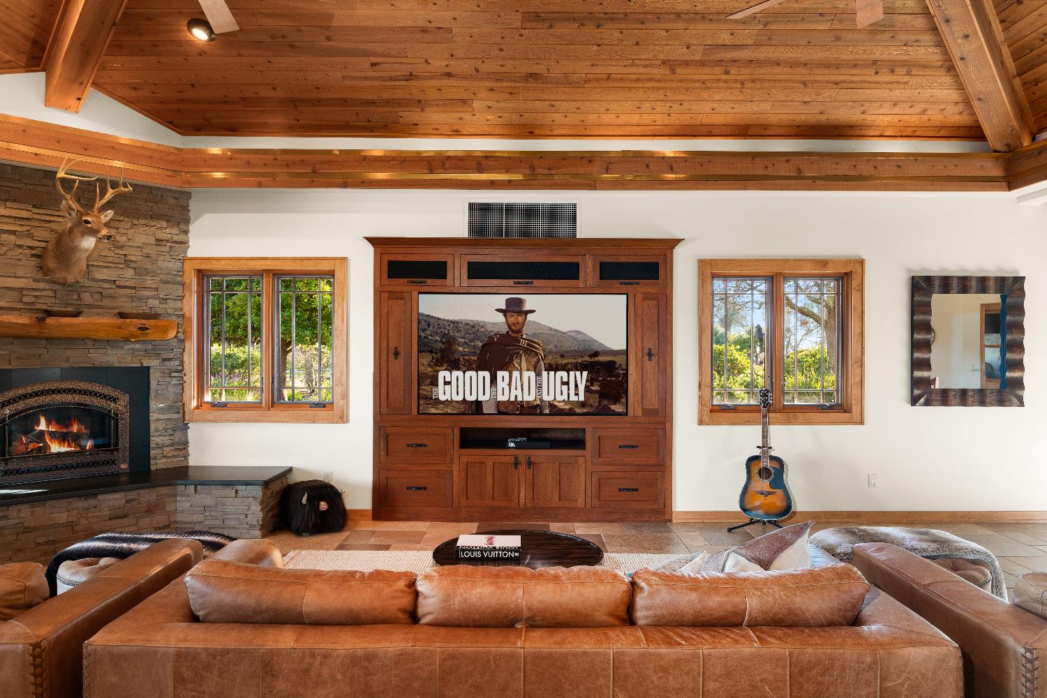 5630 Grazing Hill Road Shingle Springs, CA 95682 - Photo 29 of 86 a living room with furniture a fireplace and a flat screen tv
