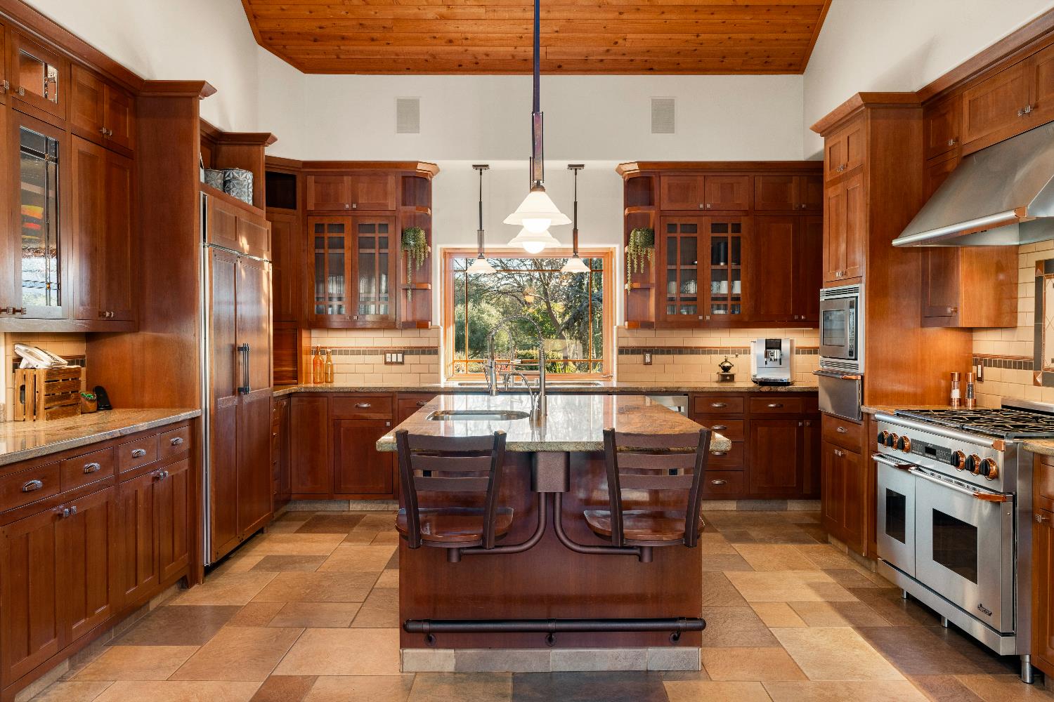 5630 Grazing Hill Road Shingle Springs, CA 95682 - Photo 39 of 86 a kitchen with stainless steel appliances granite countertop a stove a sink dishwasher and a refrigerator with wooden cabinets