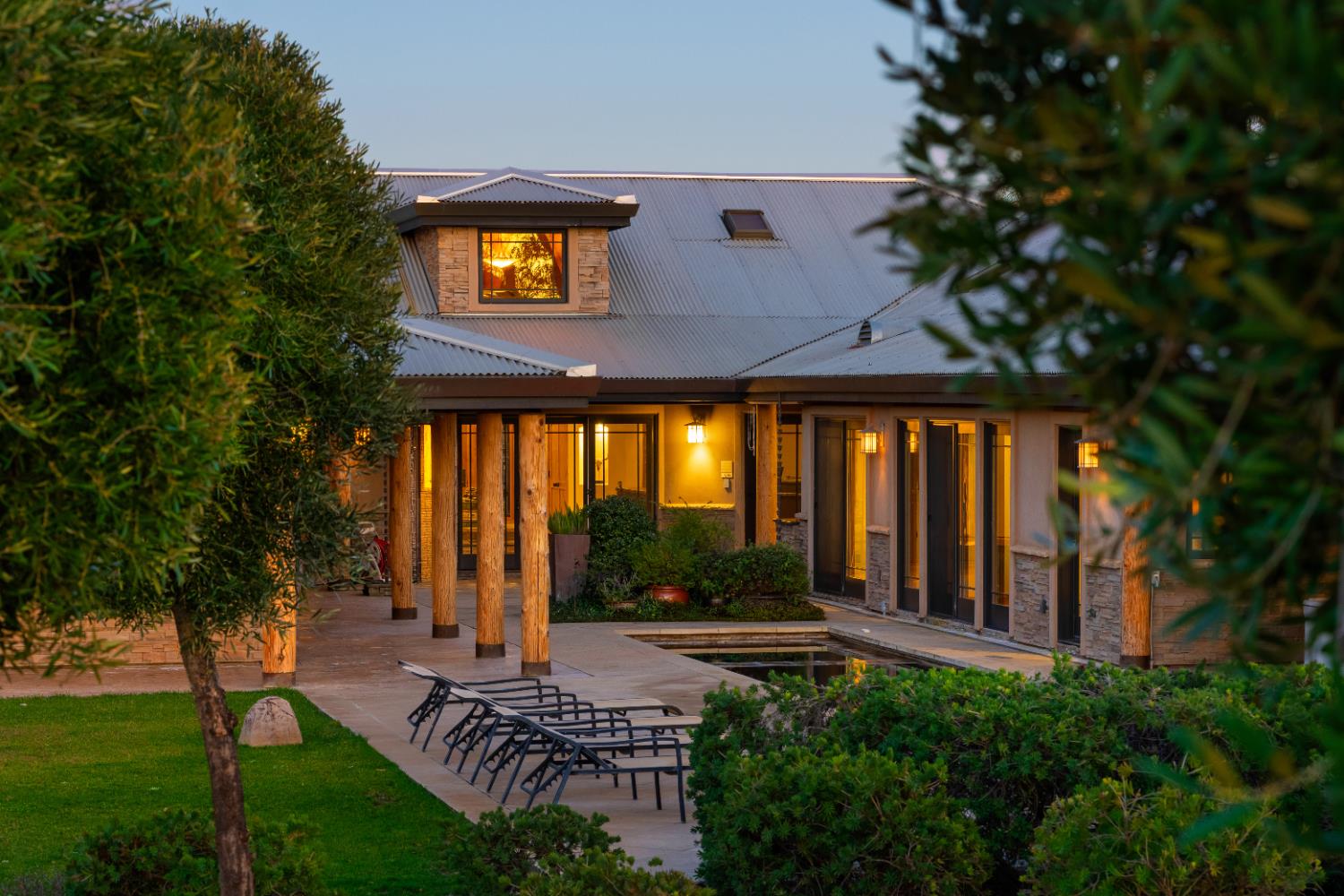 5630 Grazing Hill Road Shingle Springs, CA 95682 - Photo 4 of 86 a view of a house with brick walls and a large tree