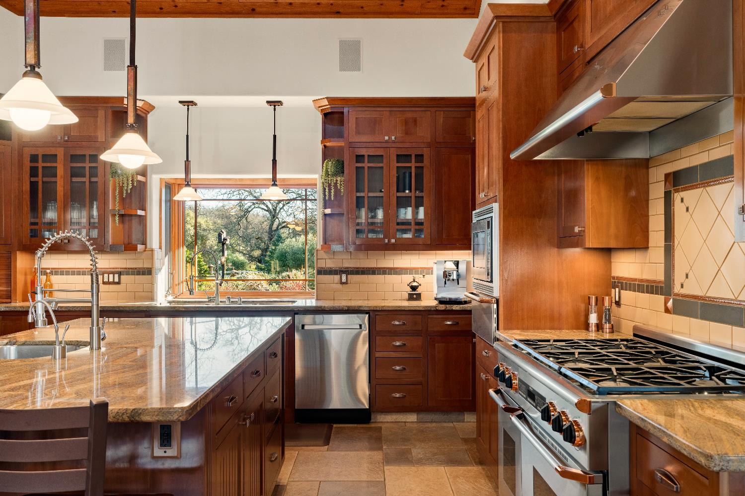 5630 Grazing Hill Road Shingle Springs, CA 95682 - Photo 41 of 86 a kitchen with stainless steel appliances granite countertop a stove and a sink