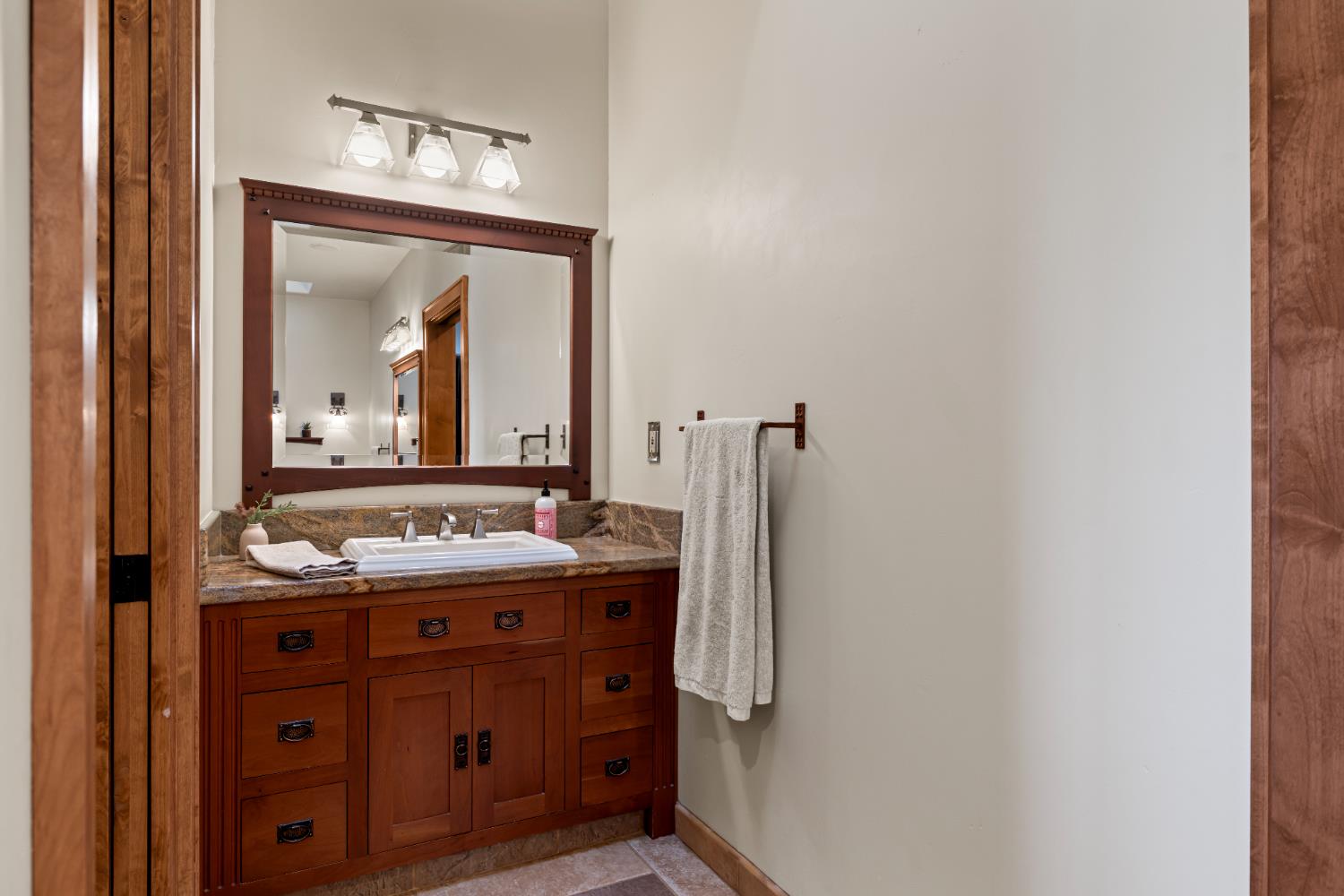 5630 Grazing Hill Road Shingle Springs, CA 95682 - Photo 47 of 86 a bathroom with a sink and a mirror