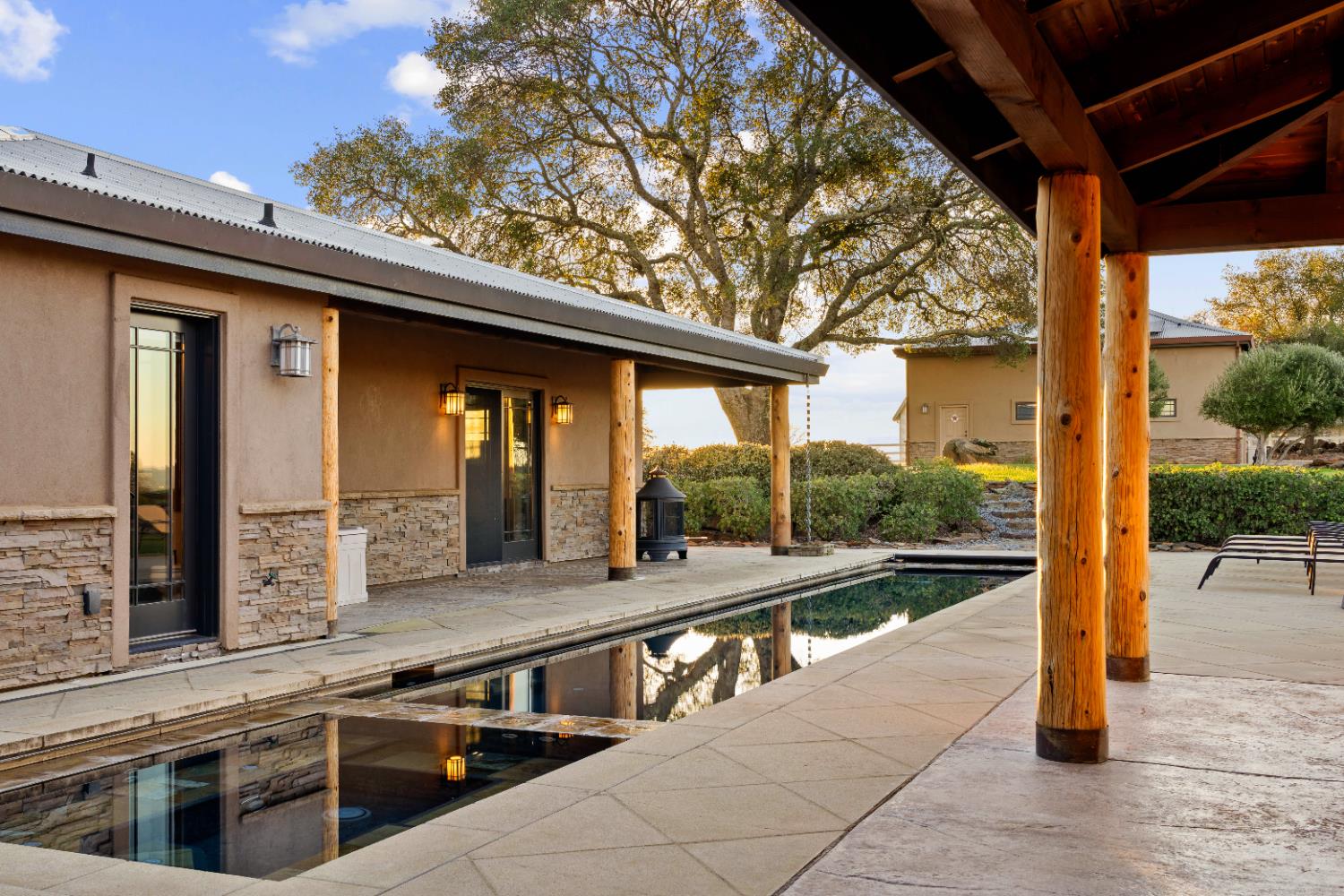 5630 Grazing Hill Road Shingle Springs, CA 95682 - Photo 58 of 86 a view of a living room and kitchen with a large window